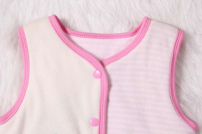 Baby girl pink winter vest neckline.