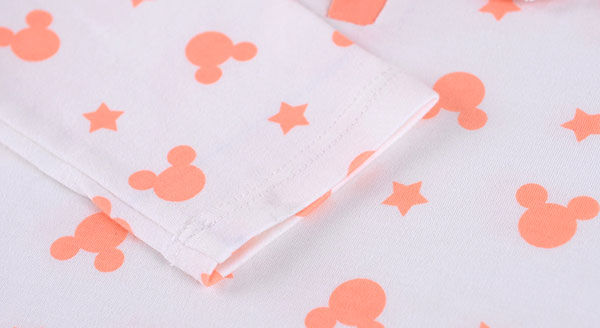 careful sewing for sleeve cuff of baby girl pajamas